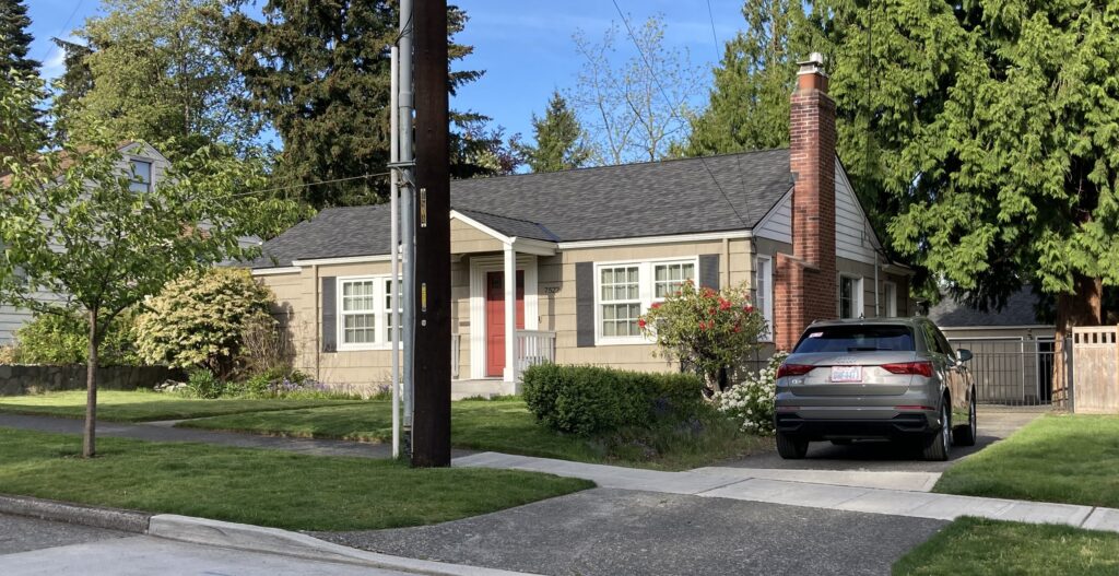 Front Before text over photo of house before additions
